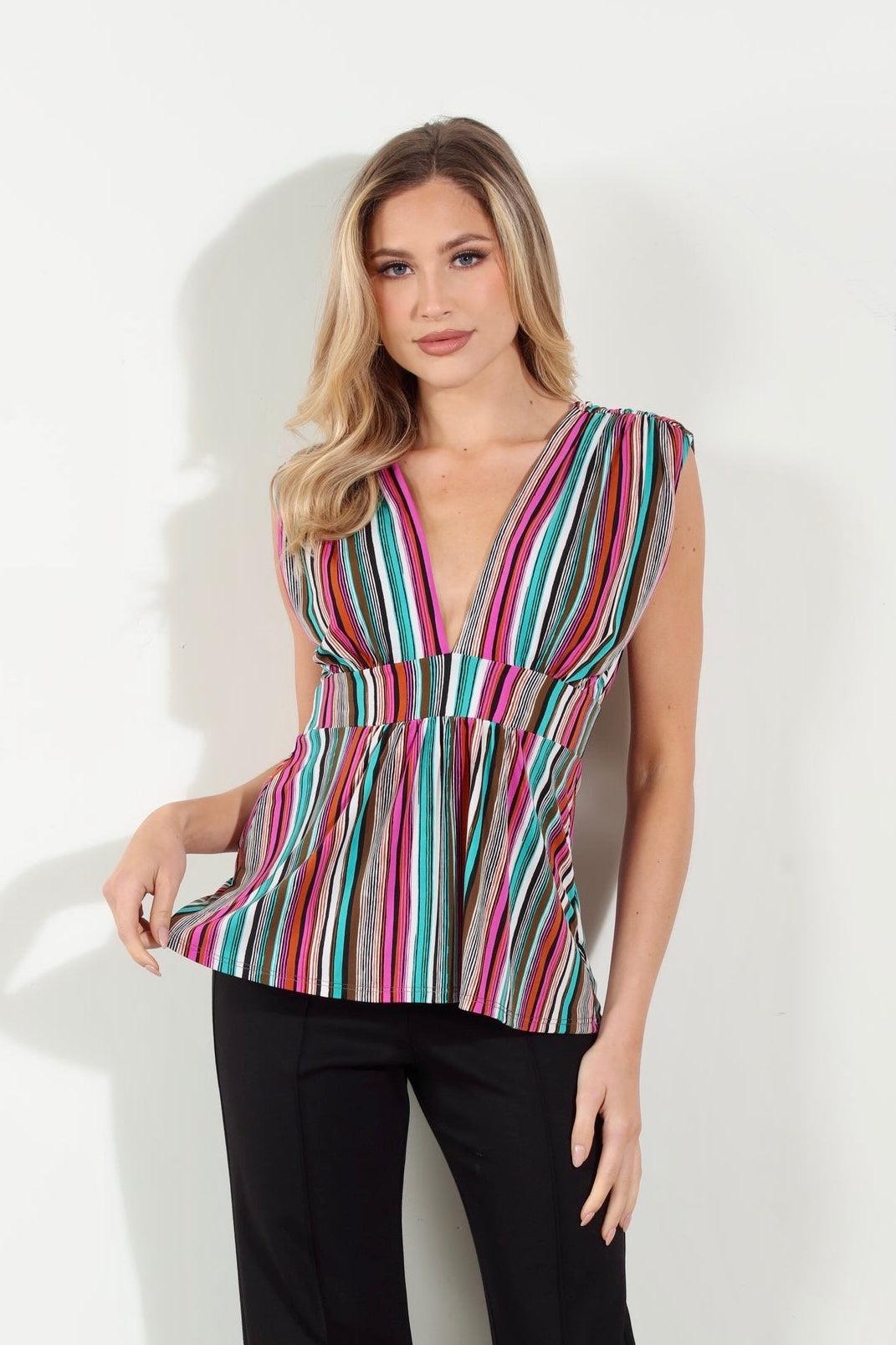 woman in multicolored sleeveless blouse and black pants