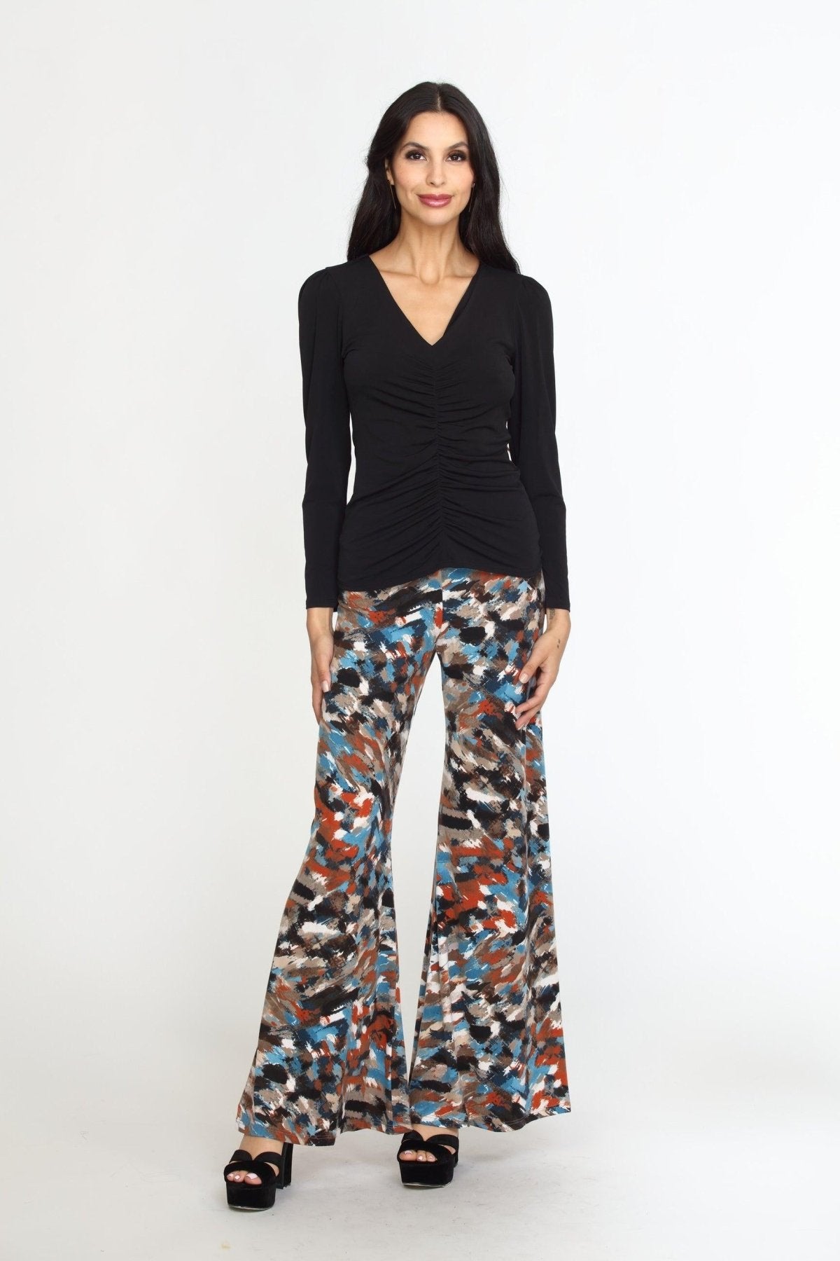 multicolored wideleg pants on woman in black heels and black long sleeve top