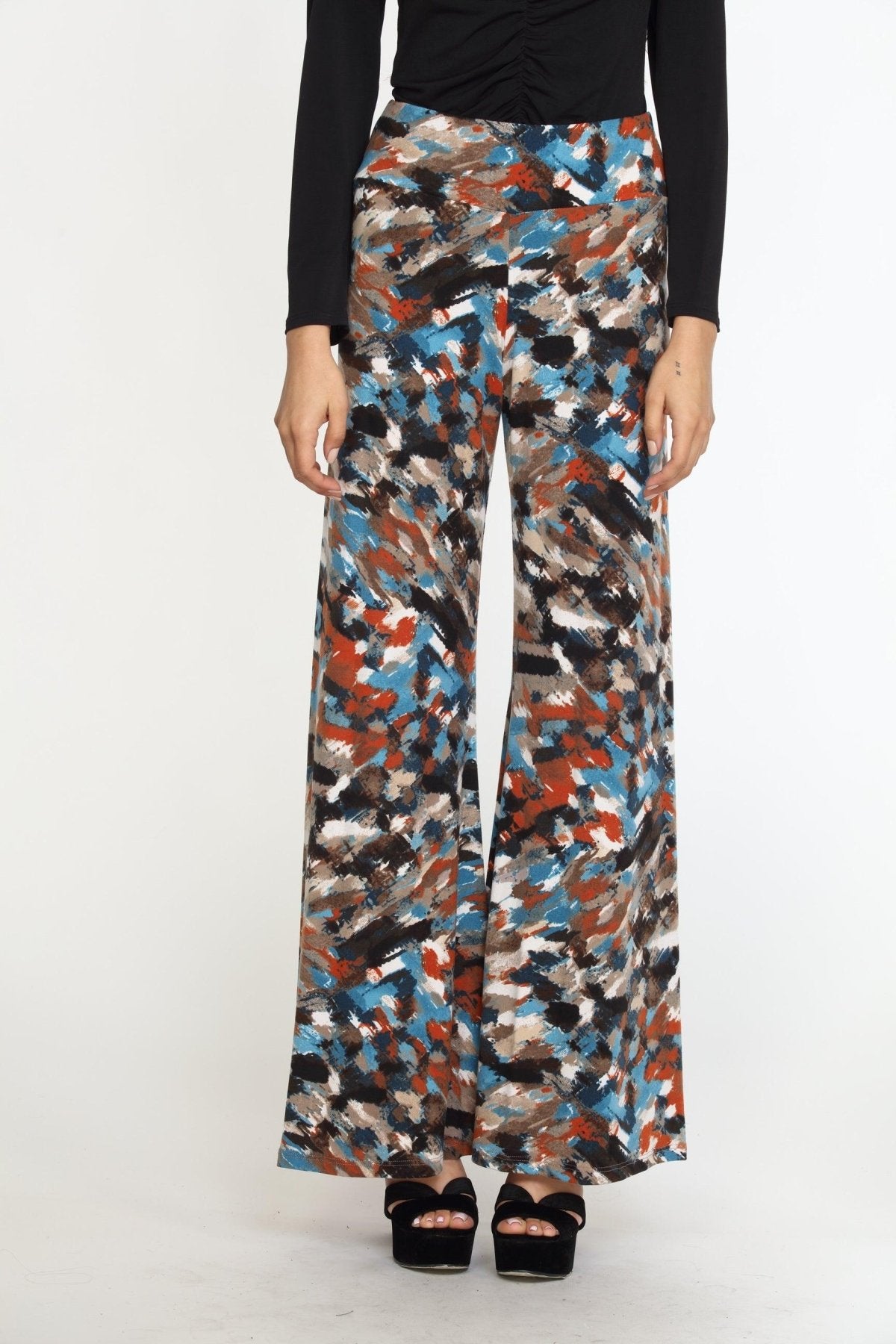 multicolored wideleg pants on woman in black heels and black long sleeve top
