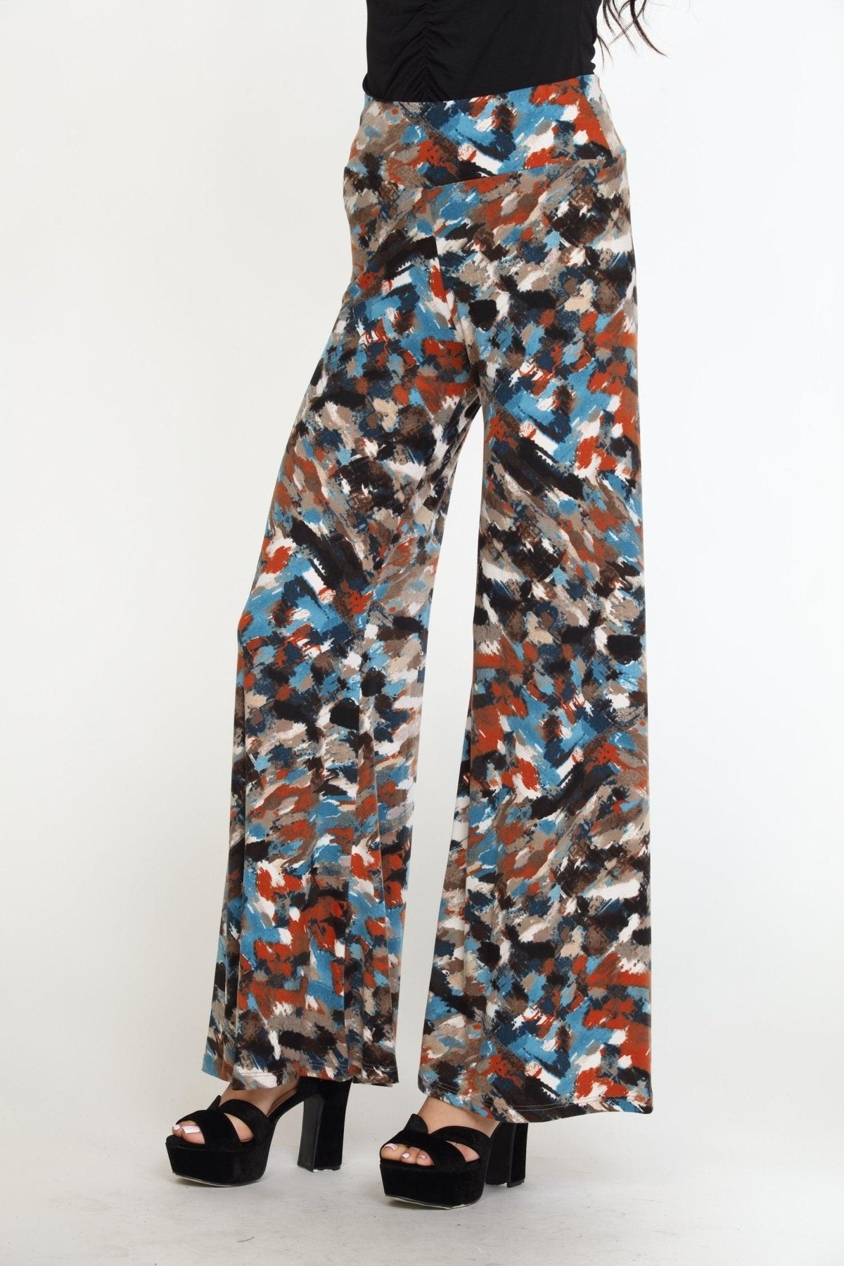multicolored wideleg pants on woman in black heels and black long sleeve top