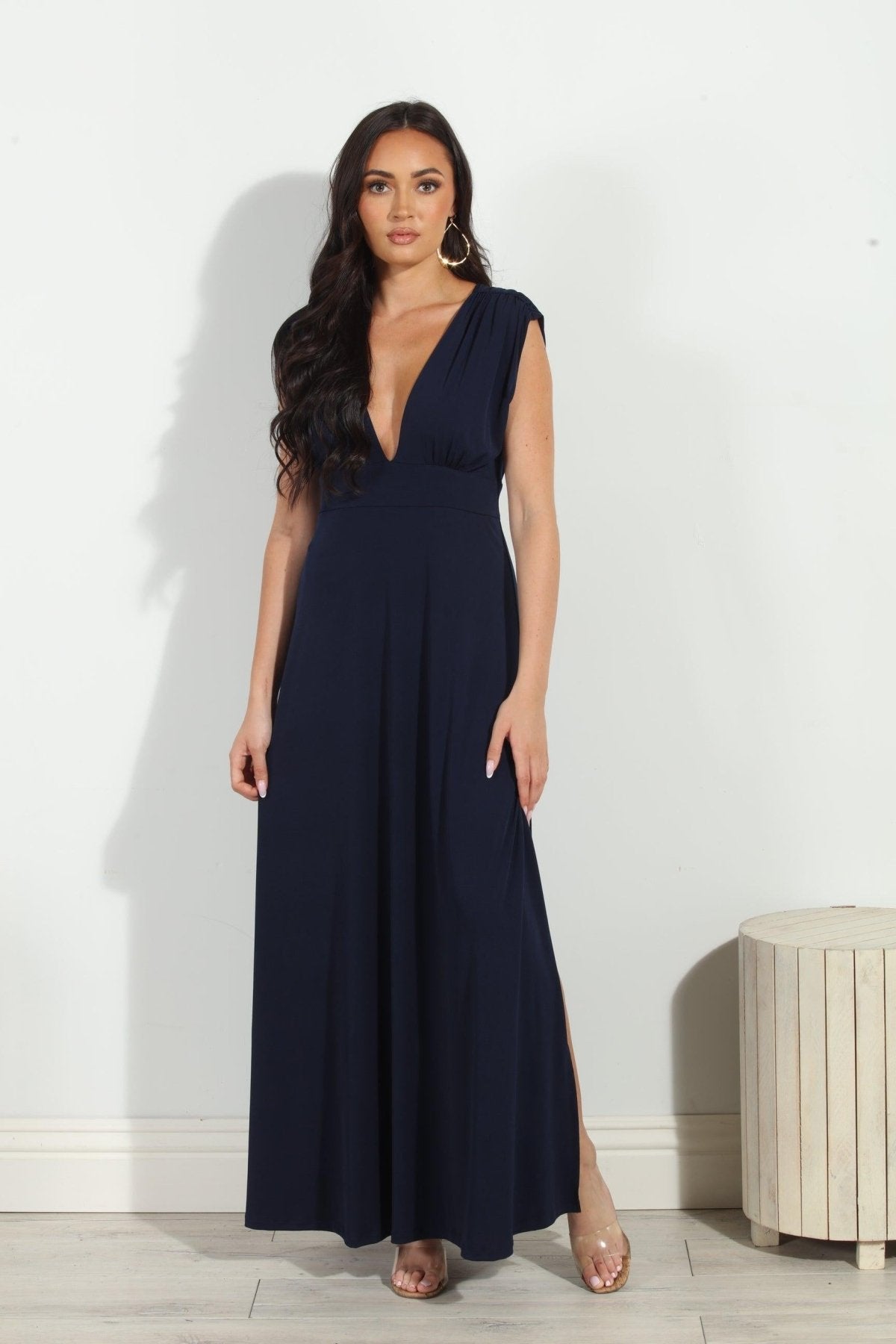 navy sleeveless maxi dress with deep neckline and side slit on woman