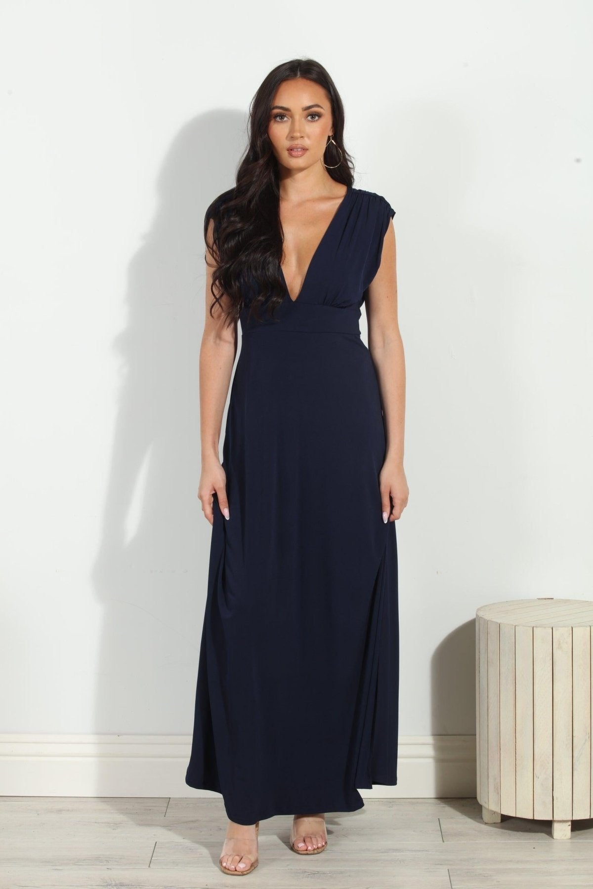 navy sleeveless maxi dress with deep neckline and side slit on woman