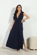 navy sleeveless maxi dress with deep neckline and side slit on woman