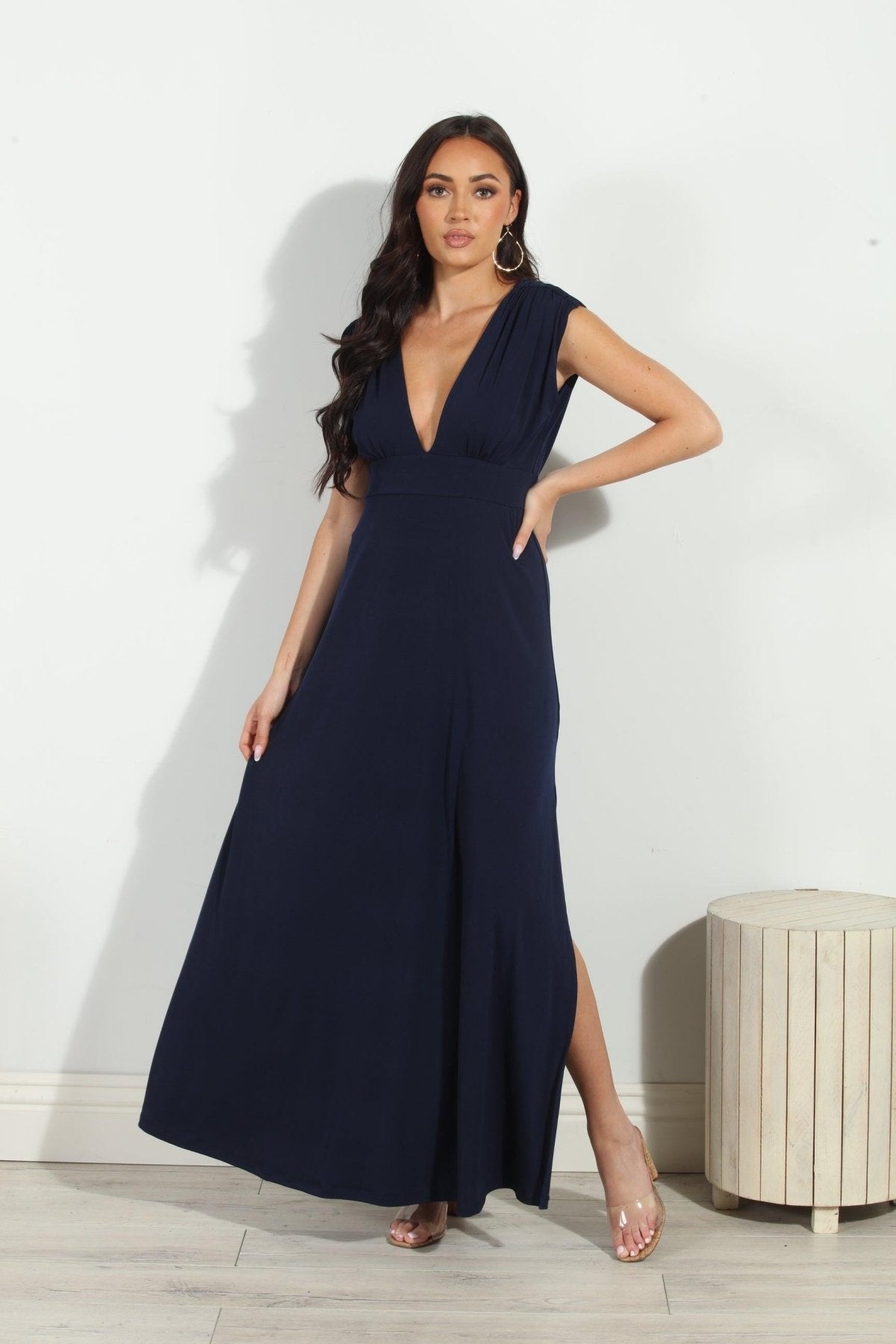 navy sleeveless maxi dress with deep neckline and side slit on woman