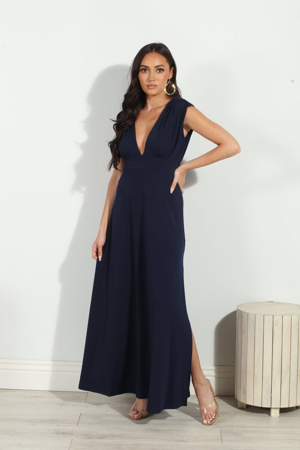 navy sleeveless maxi dress with deep neckline and side slit on woman