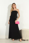 black strapless maxi dress on woman holding pink purse