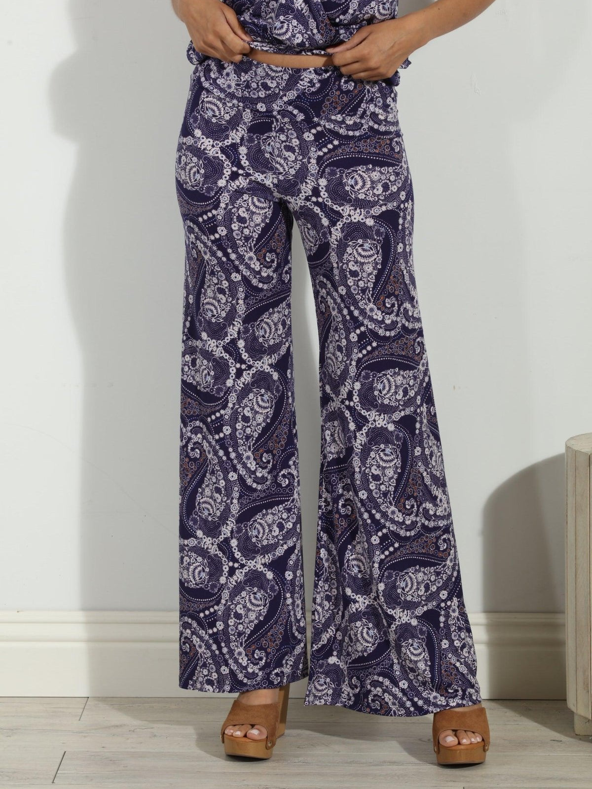 blue and white paisley wide leg pants on body