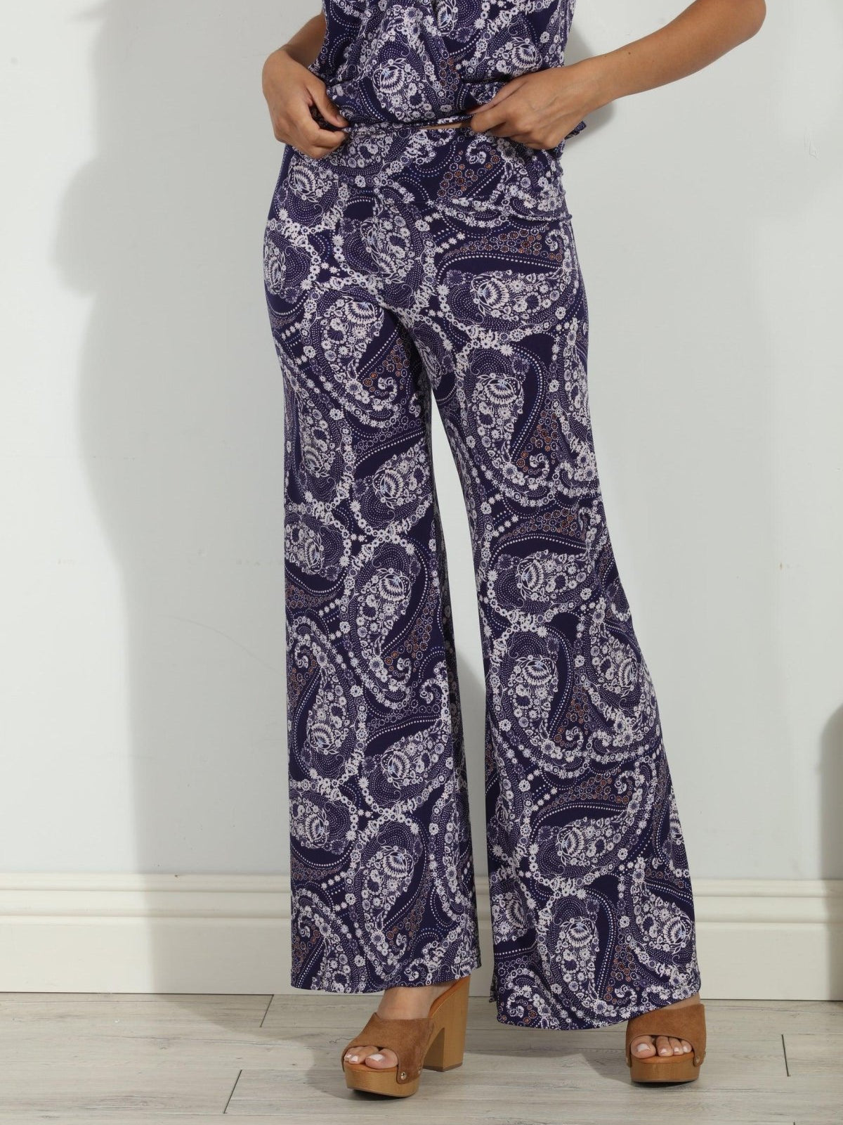 blue and white paisley wide leg pants on body