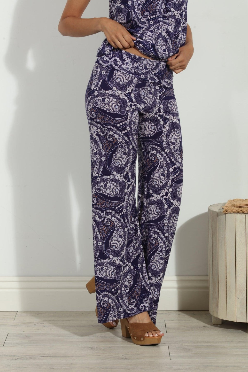 blue and white paisley wide leg pants on body