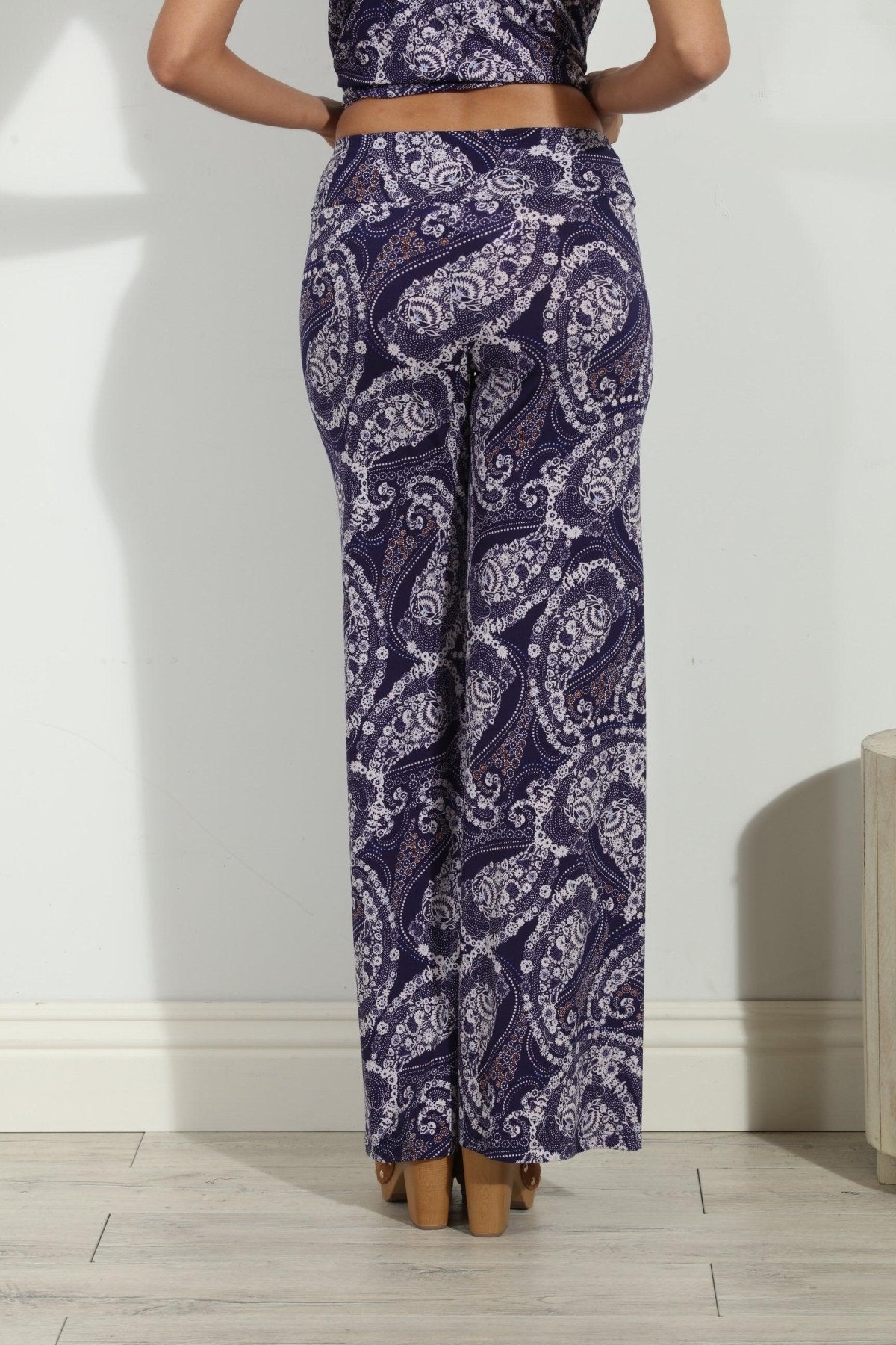 back side of blue and white paisley wide leg pants on body