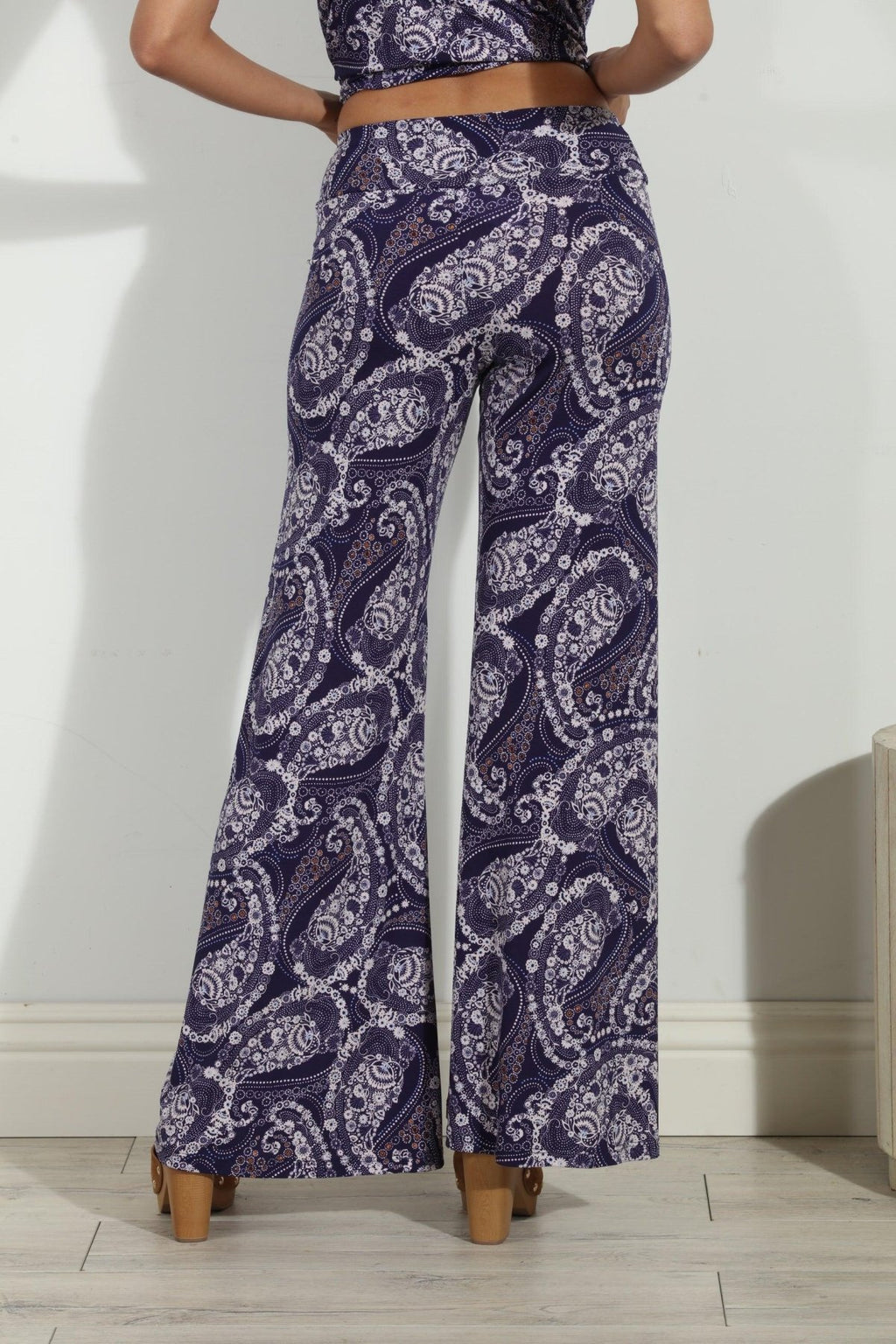 back side of blue and white paisley wide leg pants on body