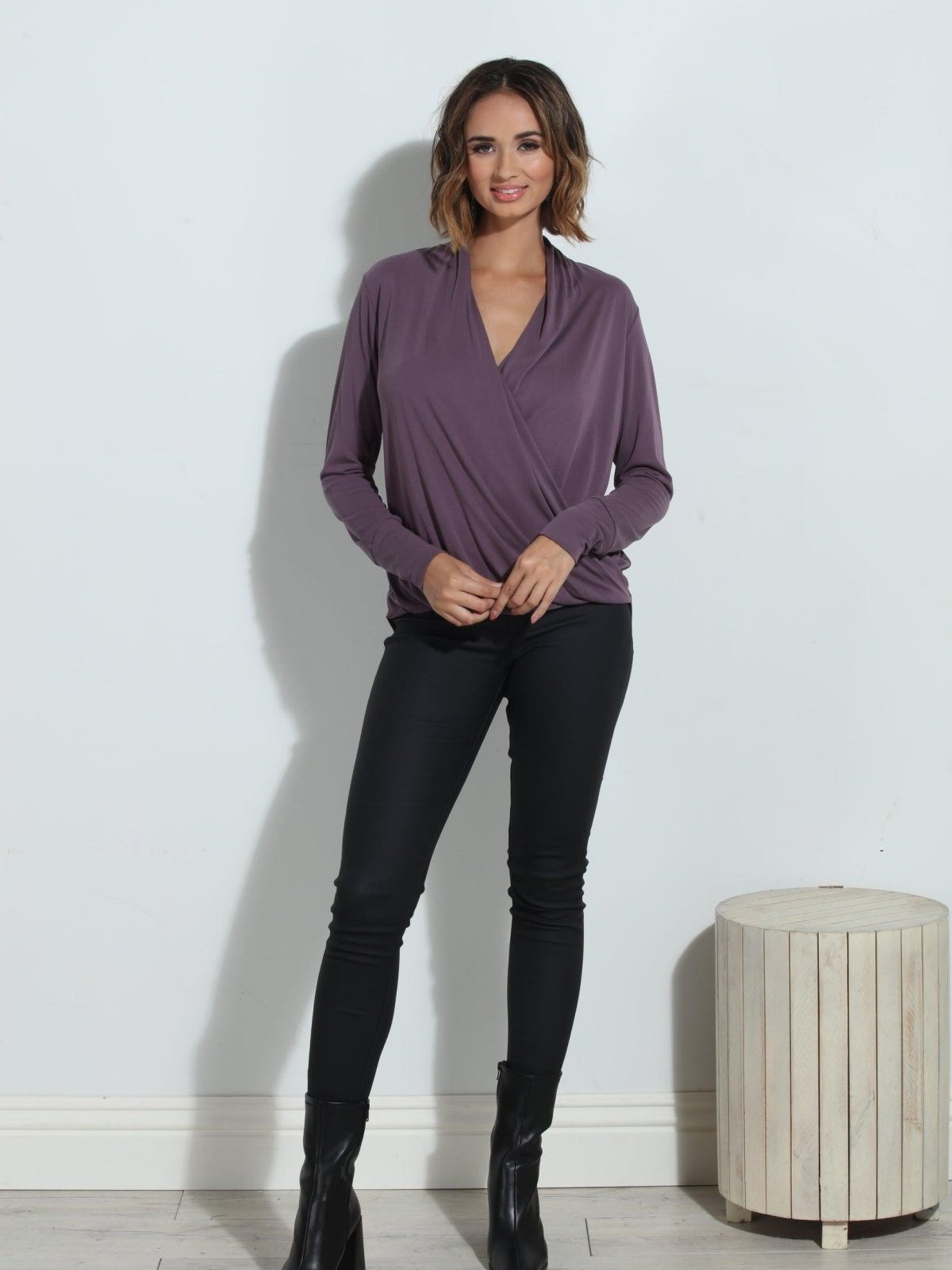 purple long sleeve blouse on woman in black pants and black boots