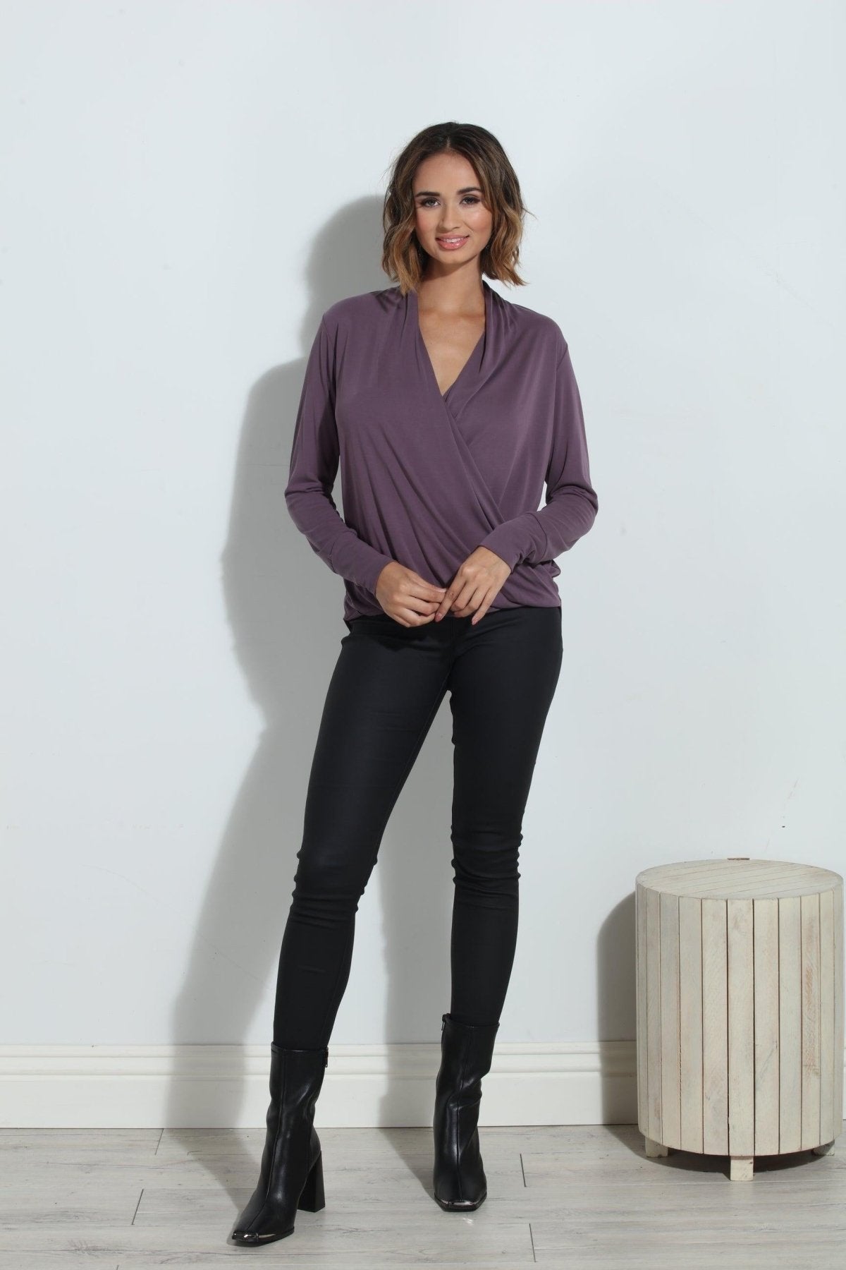 purple long sleeve blouse on woman in black pants and black boots