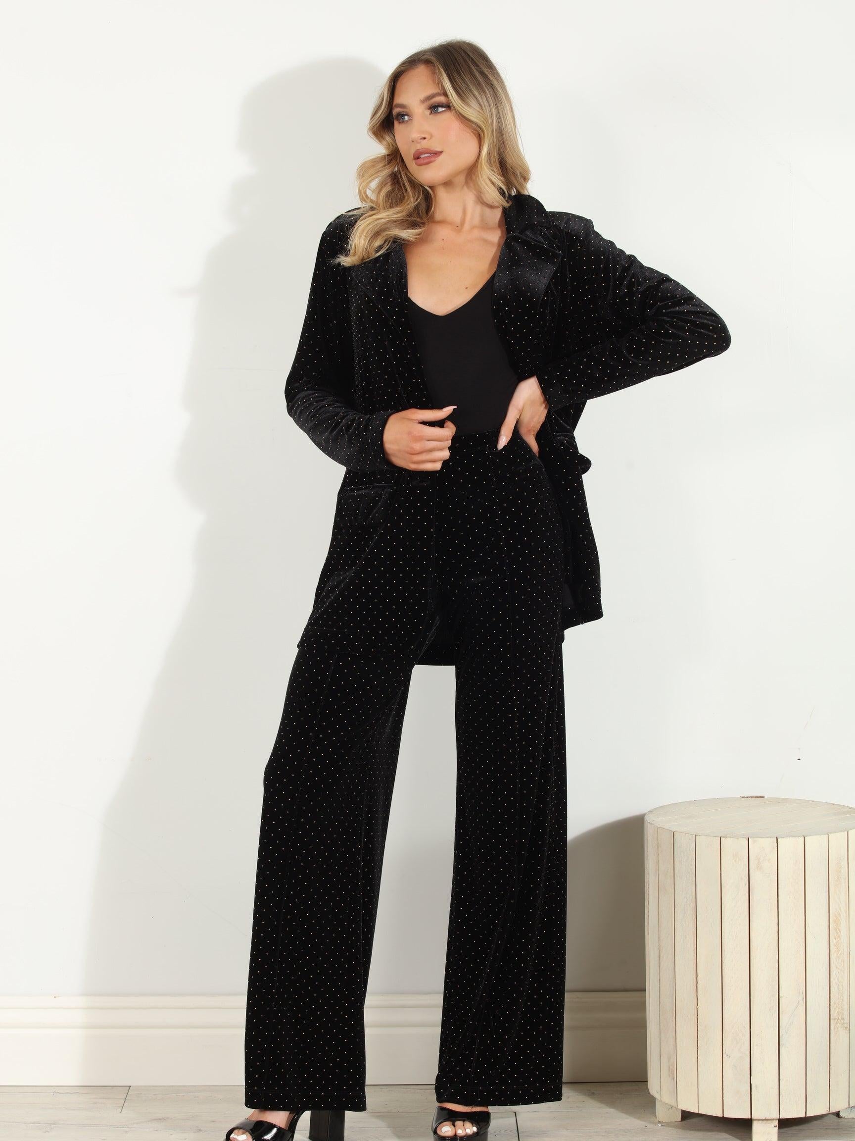 black velvet blazer and pants with shimmer detail styled on woman in black heels