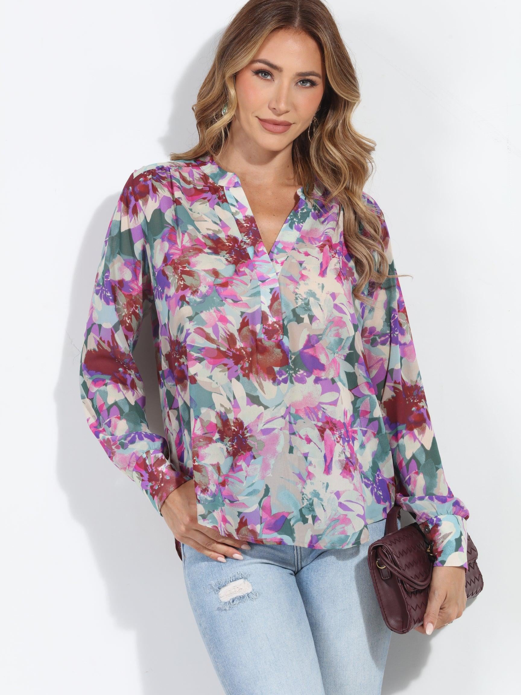 floral multicolored blouse on woman in jeans and holding dark purple blouse