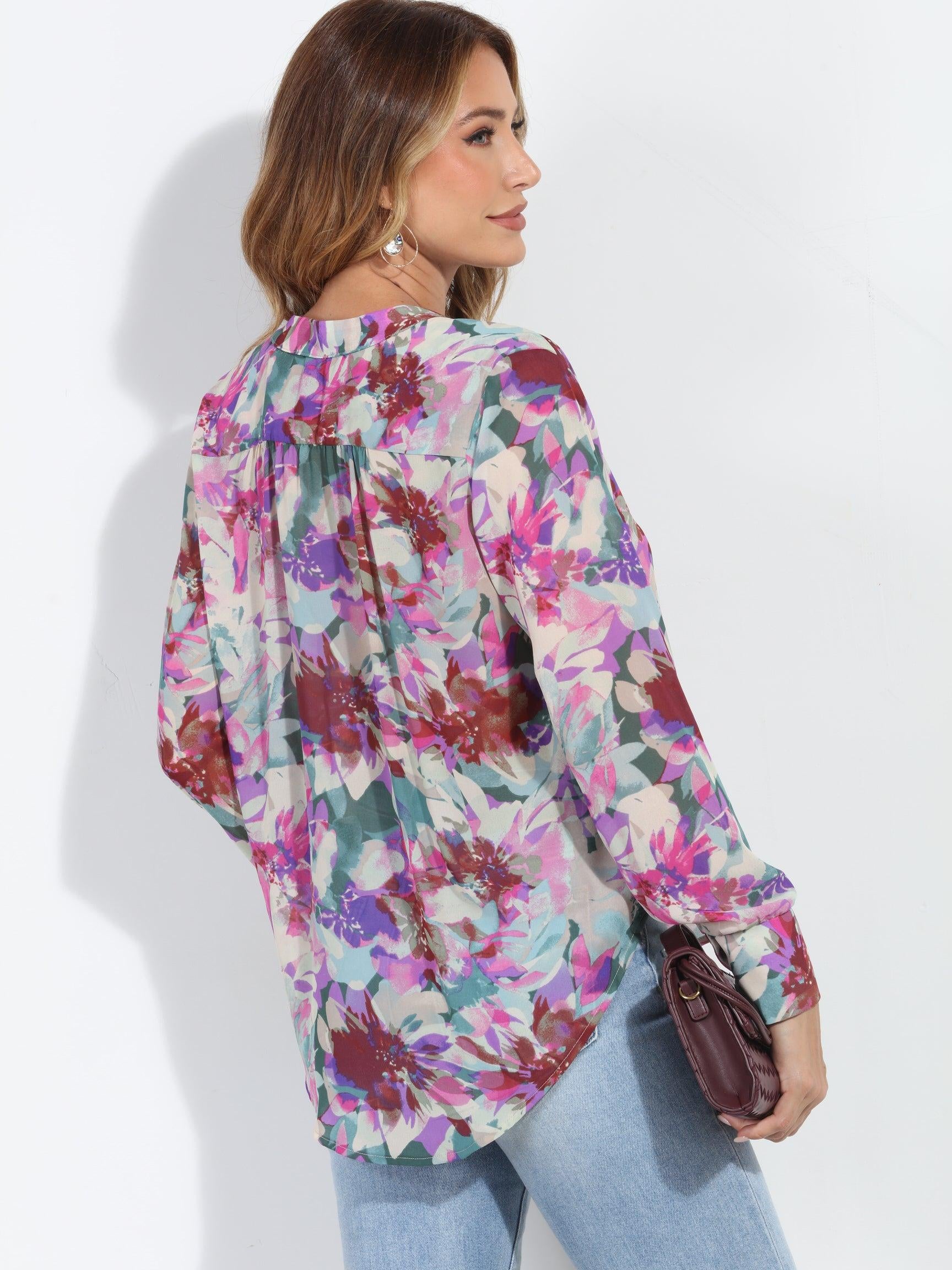 back side of floral multicolored blouse on woman in jeans and holding dark purple blouse