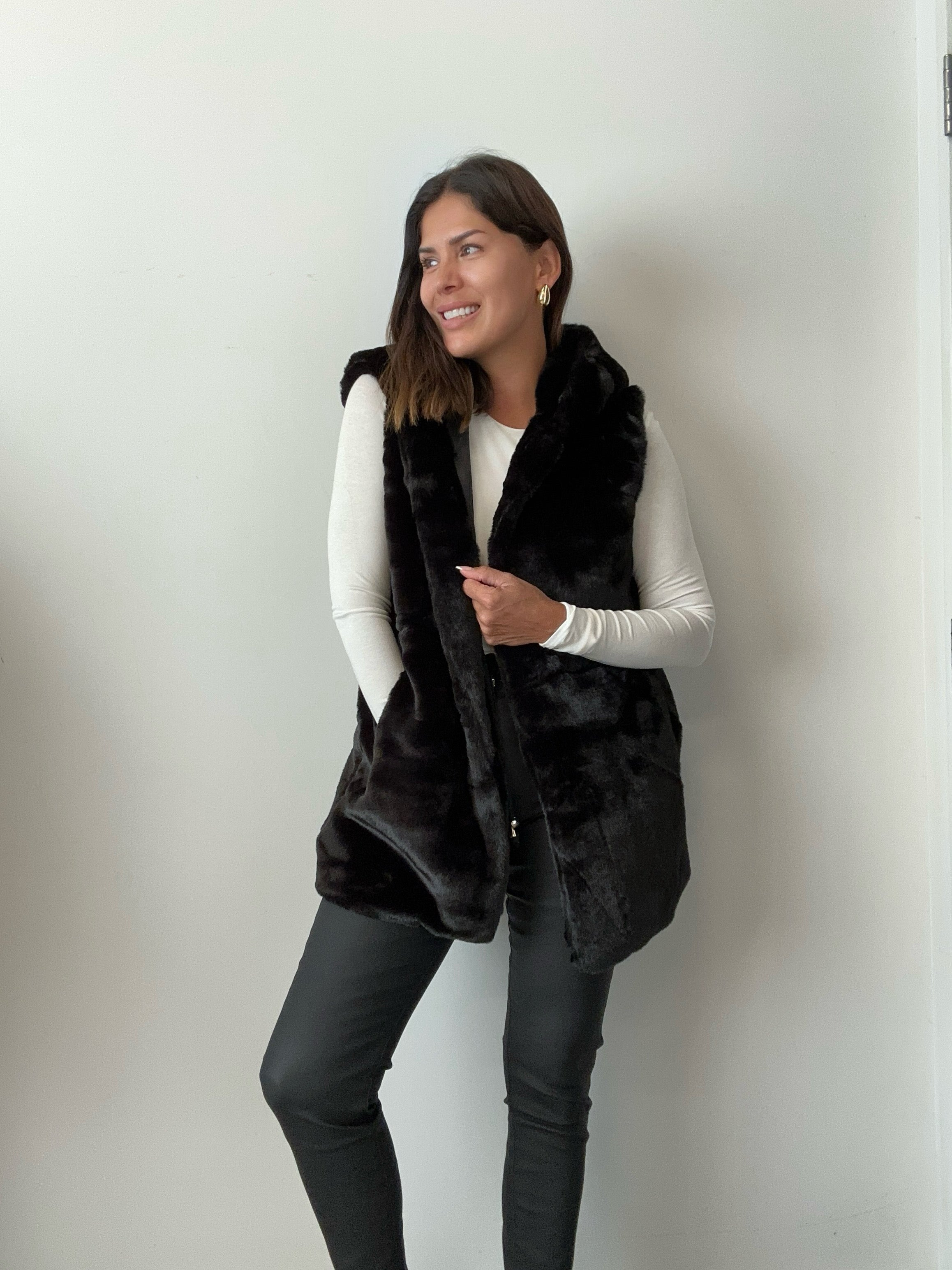 Hooded vest with on sale fur