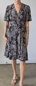 black and white paisley and shortsleeve dress on woman