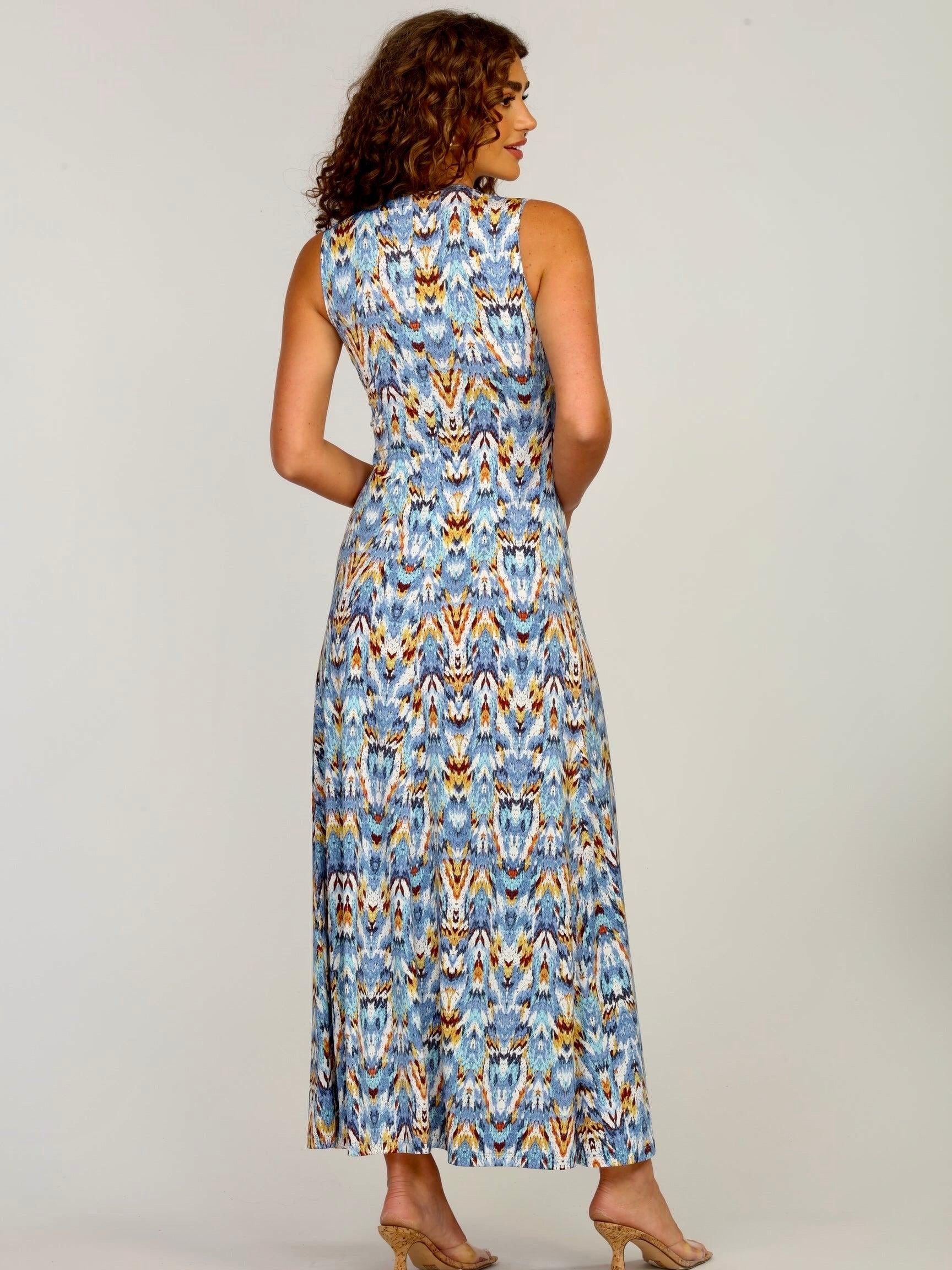 backside of woman with curly hair wearing multicolored maxi dress