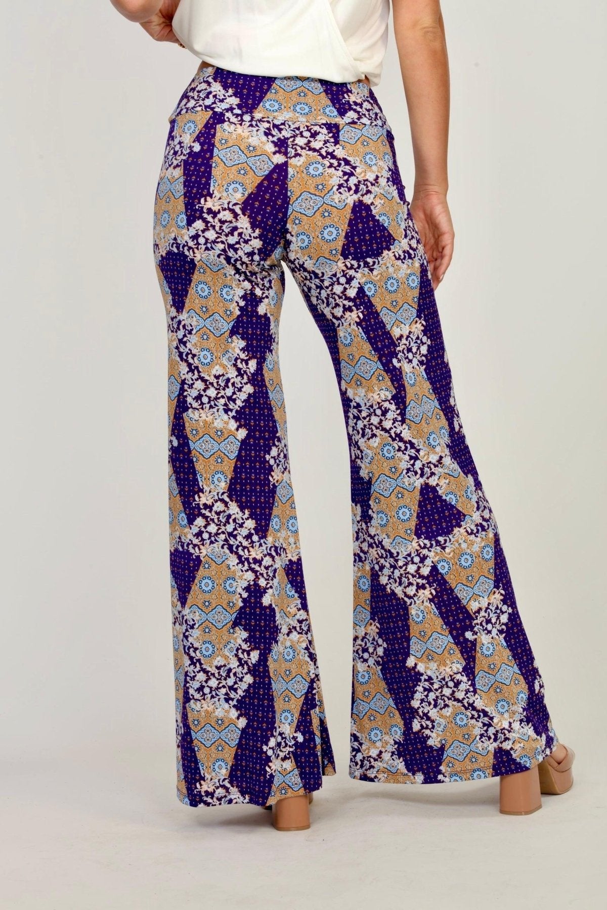back side of multicolored, printed, wide-legged pants on woman