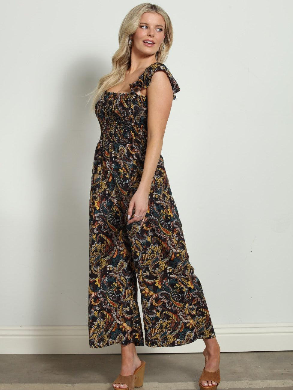 woman in multicolored sleeveless jumpsuit