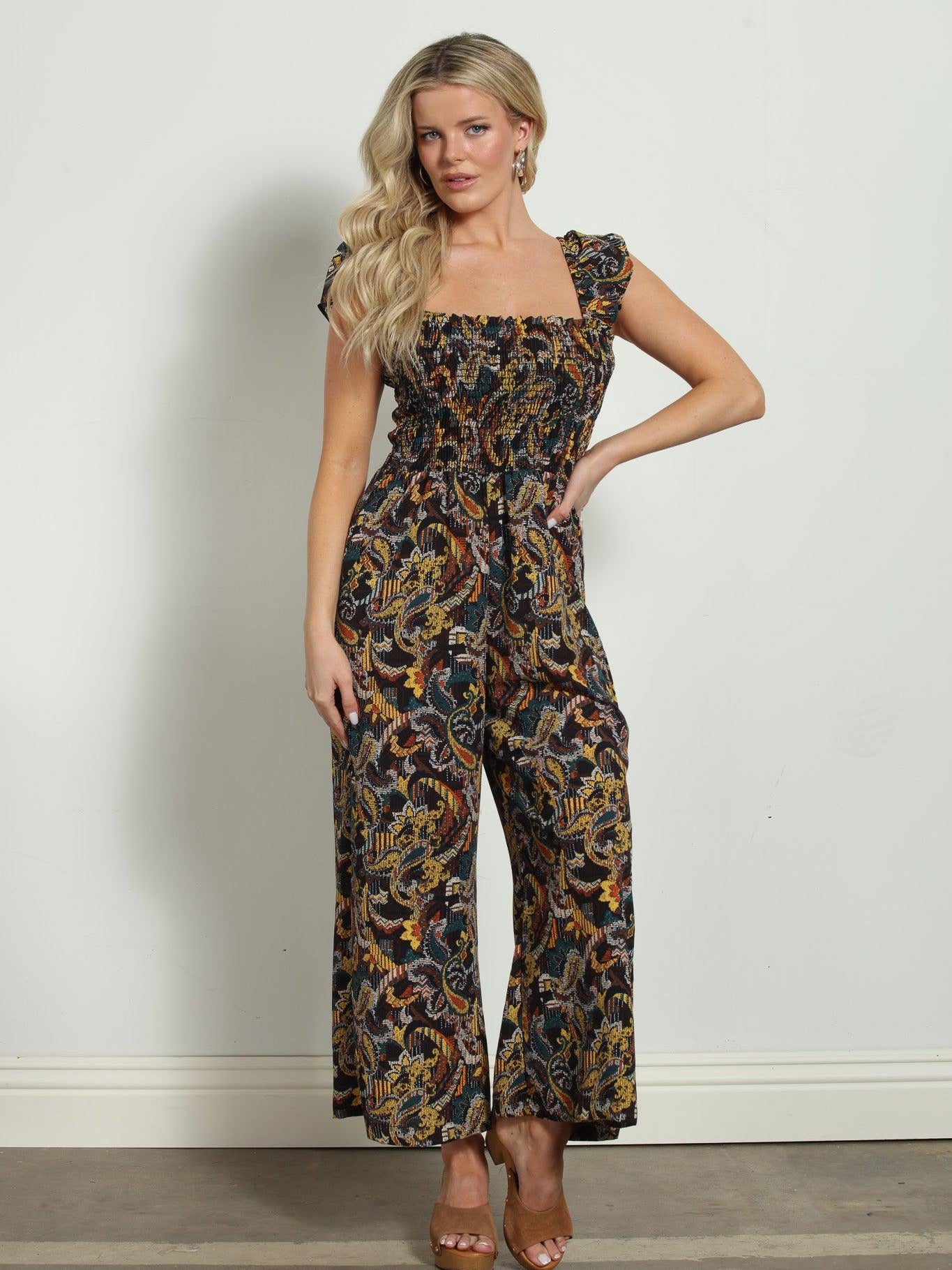 woman in multicolored sleeveless jumpsuit
