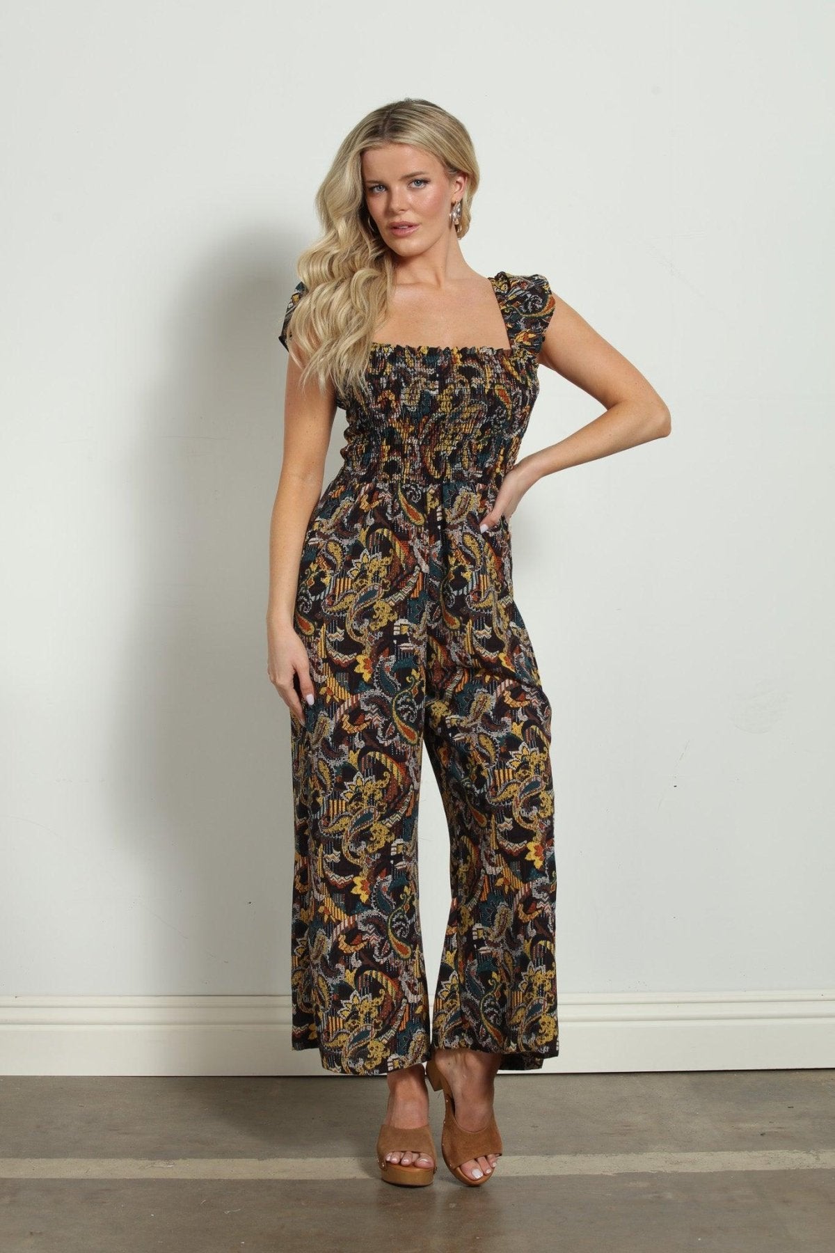woman in multicolored sleeveless jumpsuit