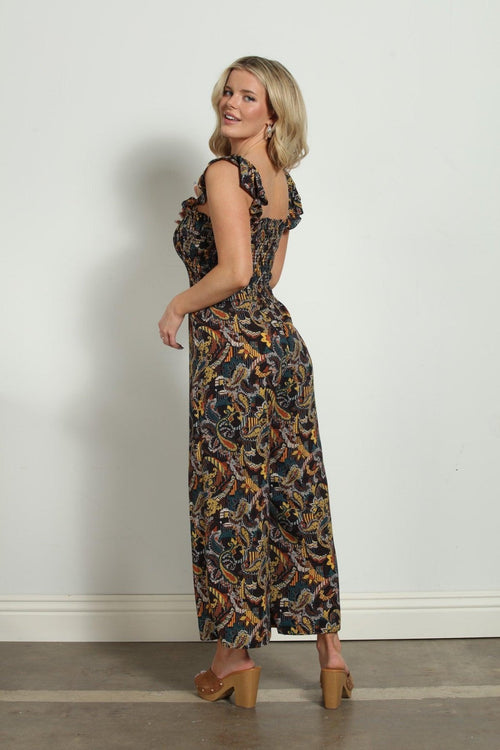 backside of woman in multicolored sleeveless jumpsuit