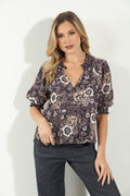 woman in multicolored short sleeve blouse and denim