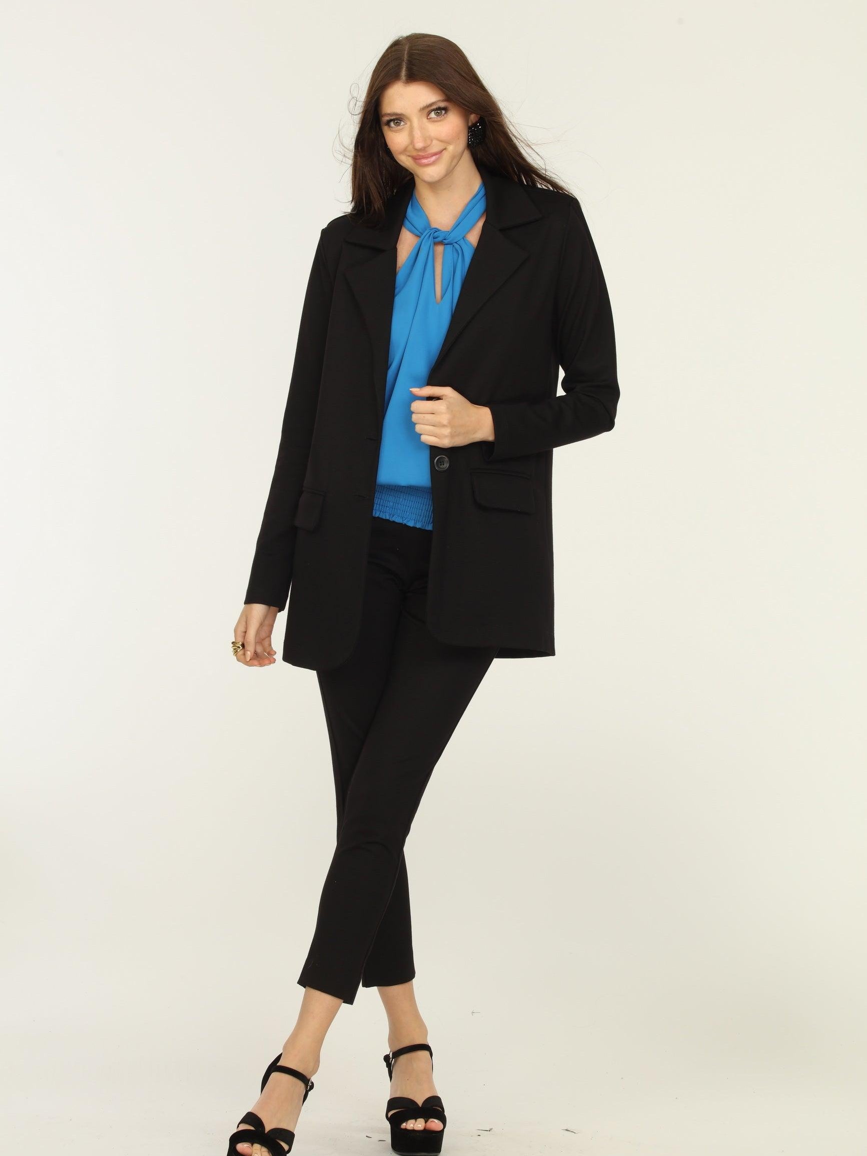 black blazer, blue top, and black pants on woman