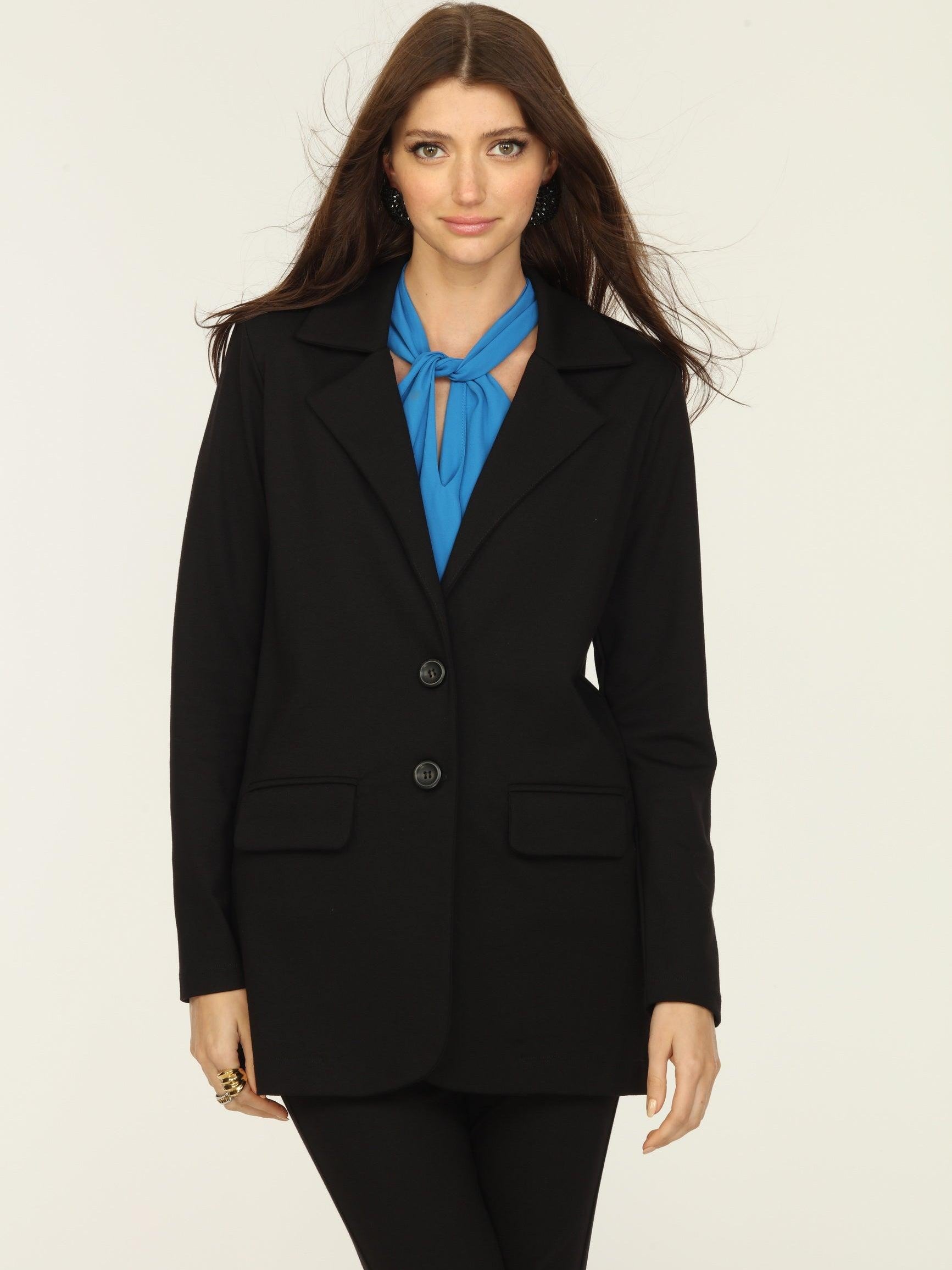 black blazer and blue top on woman