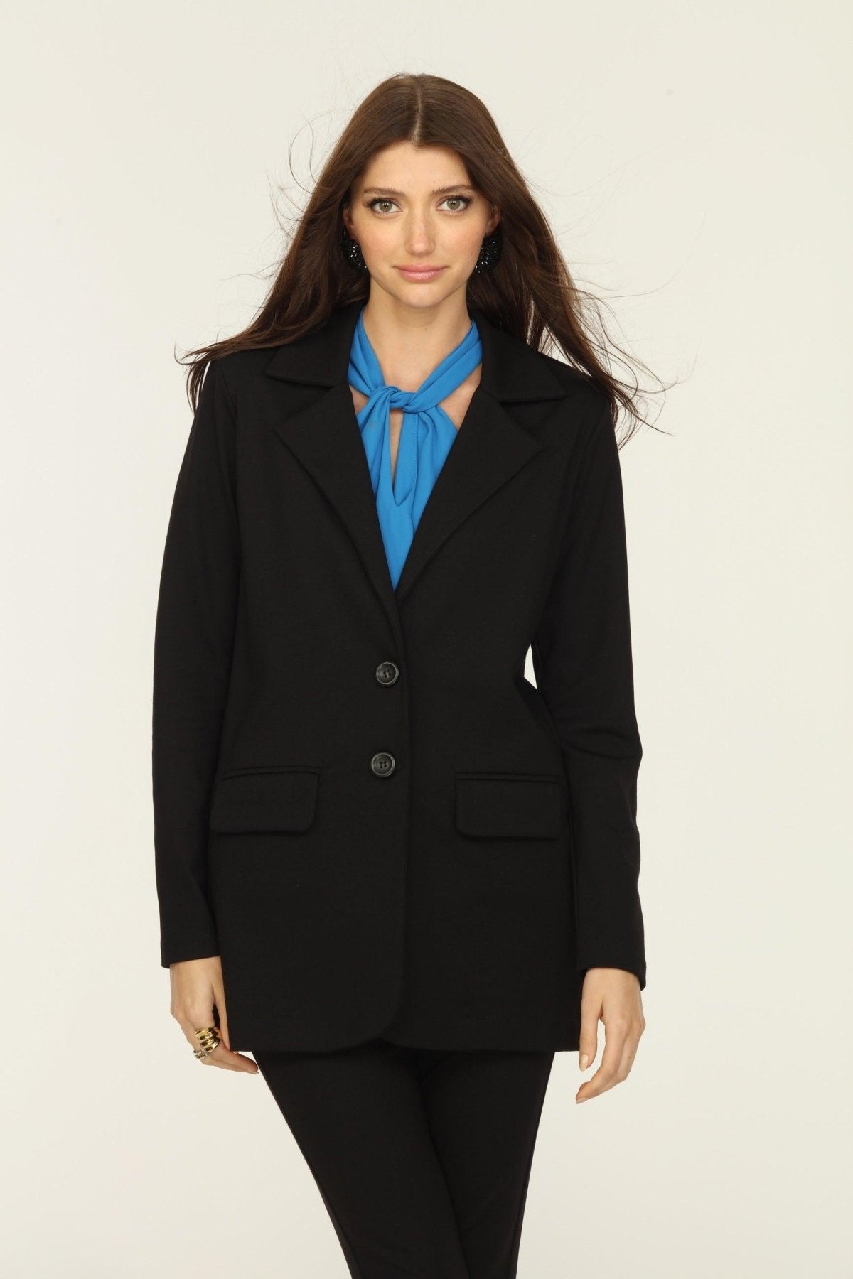black blazer and blue top on woman