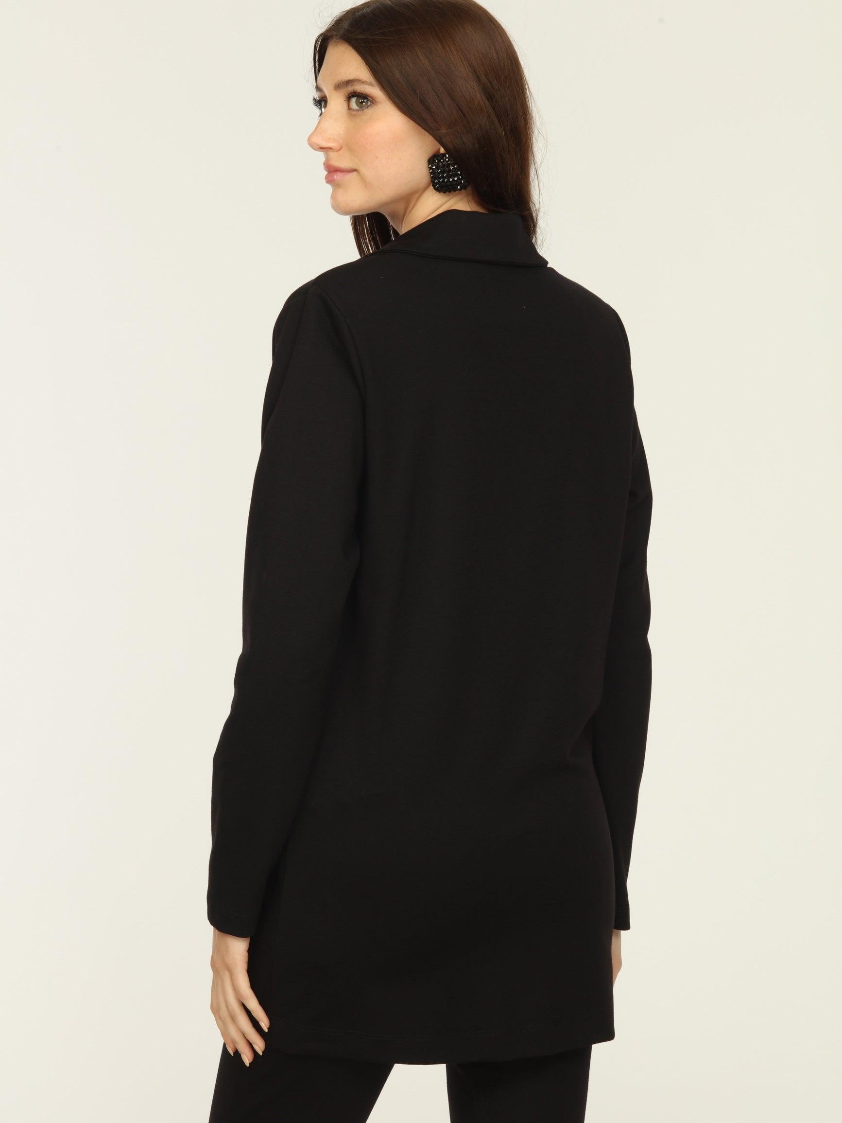 back side of black blazer and blue top on woman
