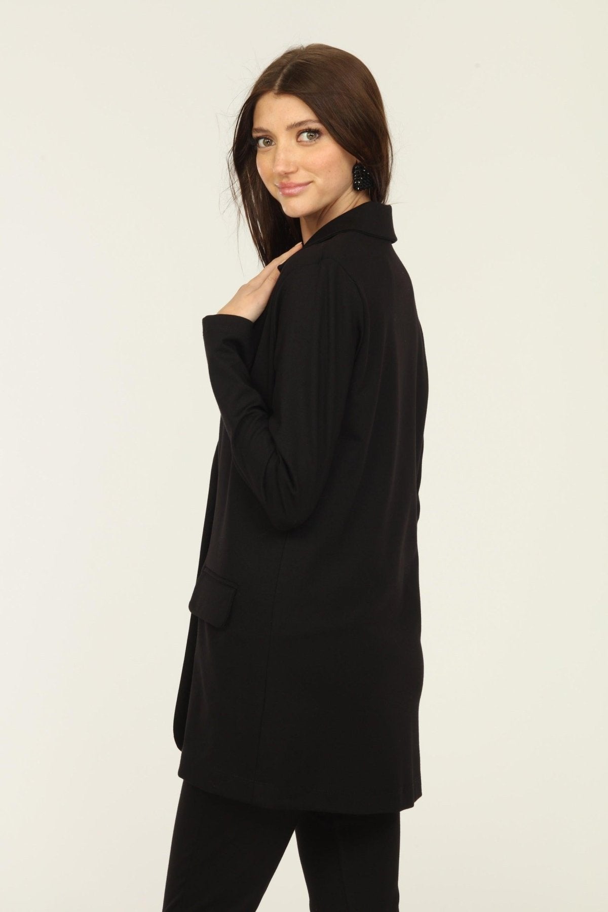 side view of black blazer on woman