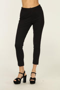 black tapered pants on woman in black heels
