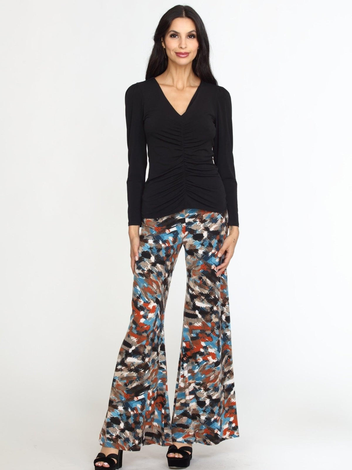 multicolored wideleg pants on woman in black heels and black long sleeve top