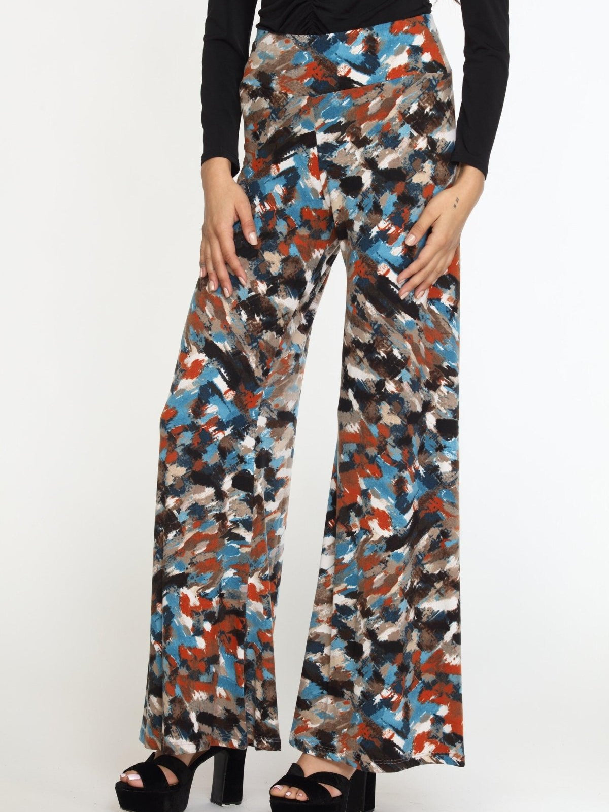 multicolored wideleg pants on woman in black heels and black long sleeve top