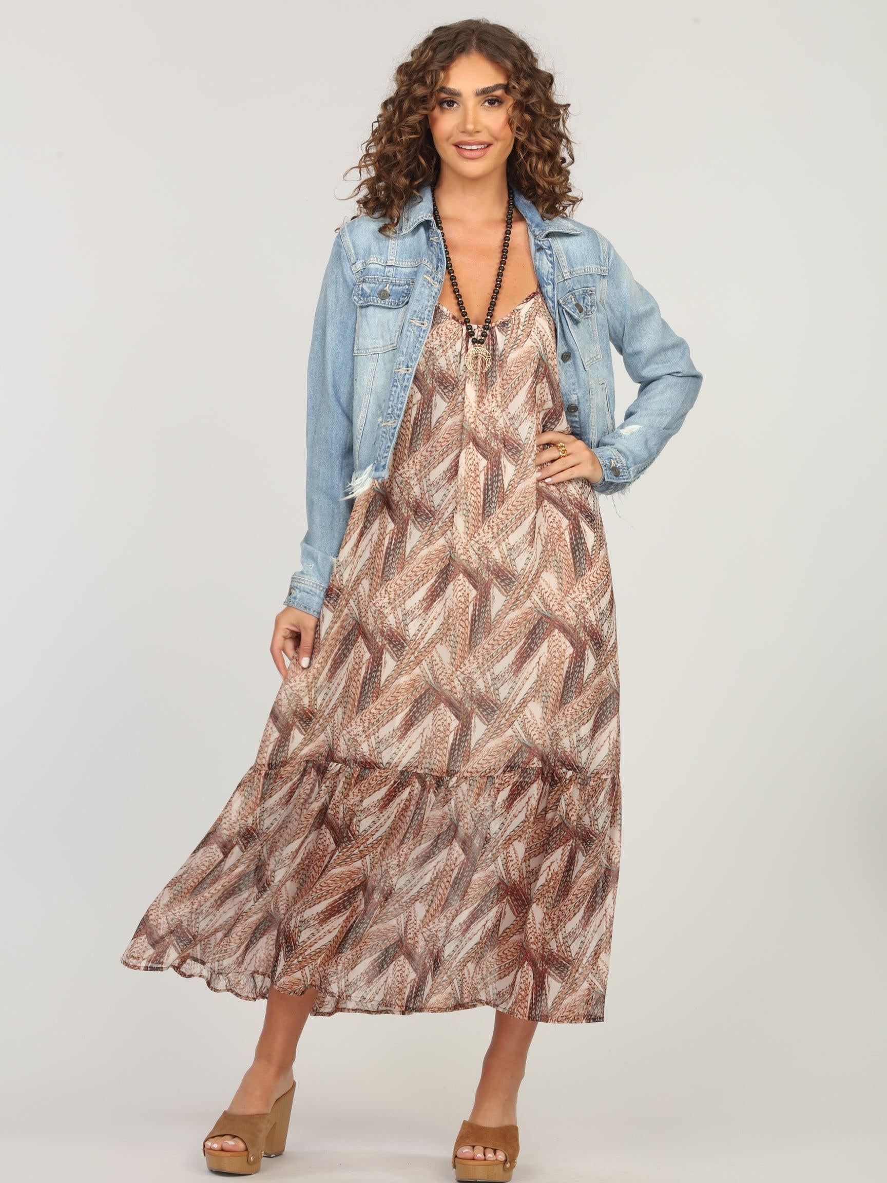 multicolored maxi dress and jean jacket on woman