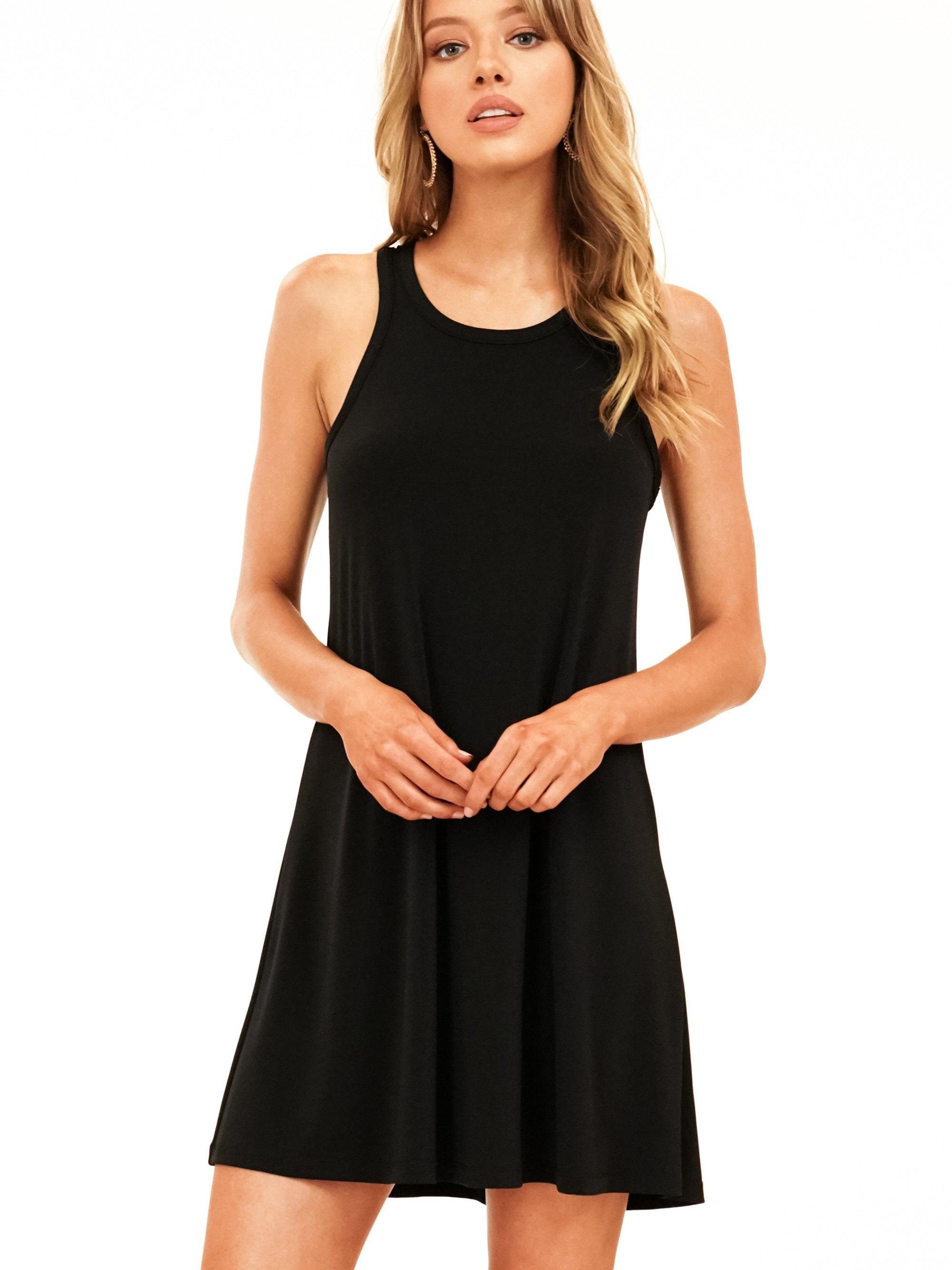 black sleeveless dress on woman