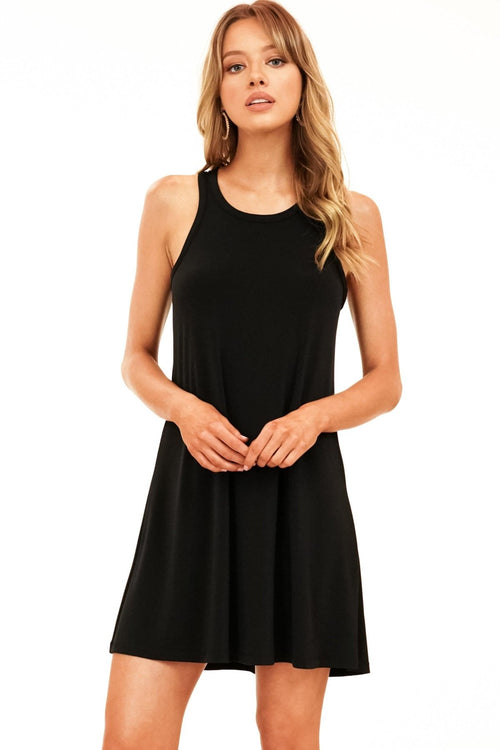 black sleeveless dress on woman