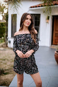 multicolored off the shoulder romper on woman